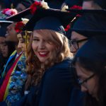 Cypress College graduates seated and focused on the commencement ceremony,