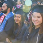 Cypress College graduates seated and focused on the commencement ceremony,