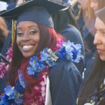 Cypress College graduates seated and focused on the commencement ceremony,