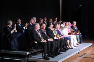 42nd Americana awardees seated on stage.