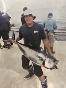 Photograph of Sergio Leonardo holding a fish