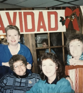 Four women in a group photo