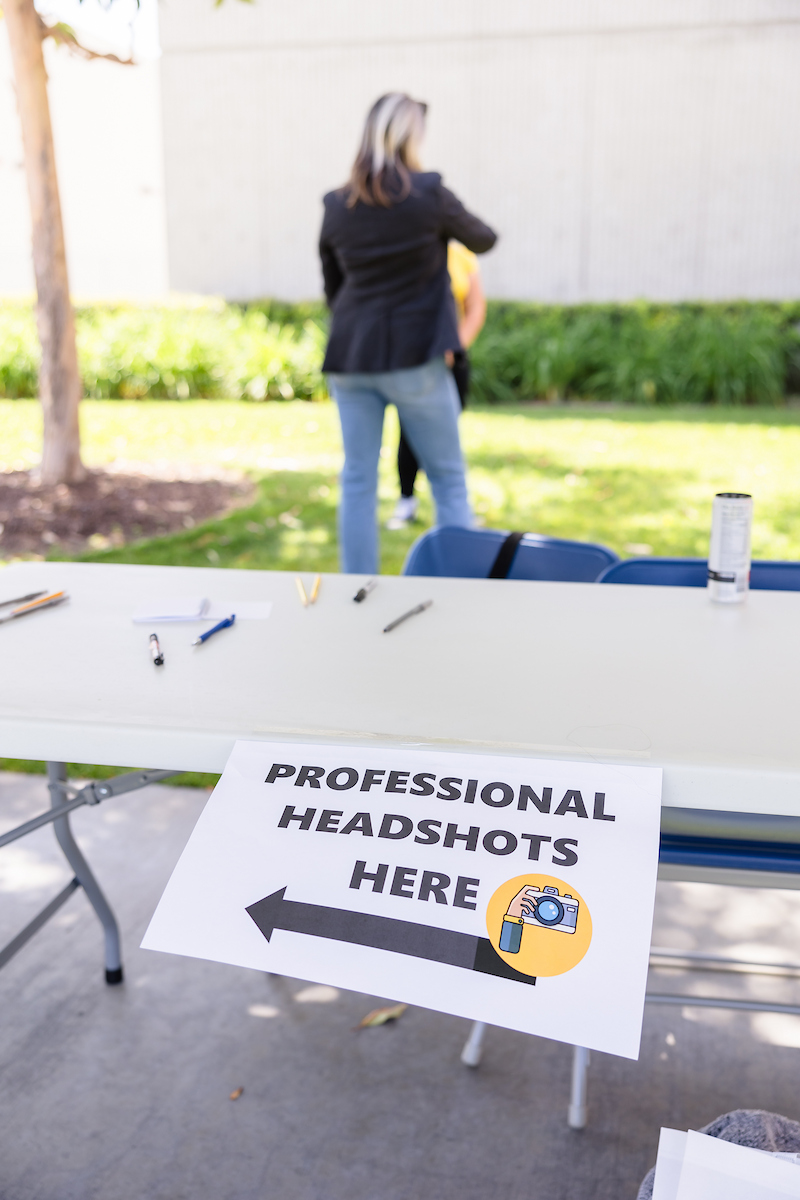 A photobooth for LInkedIn shows a photographer in the background