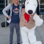 Smiling young man with Snoopy