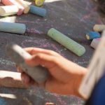 Child holding chalk