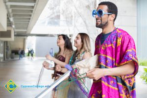 Students handing out beads during Mardi Gras parade.