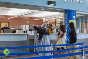 Group of dancers at the Bursar office counter.