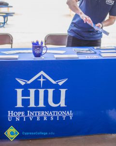Table with Hope International University table drape