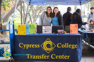 Two young ladies at the Cypress College Transfer Center table.