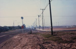 A stop sign and empty land