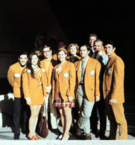 Group wearing gold coats