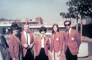 Men and women in coats on campus