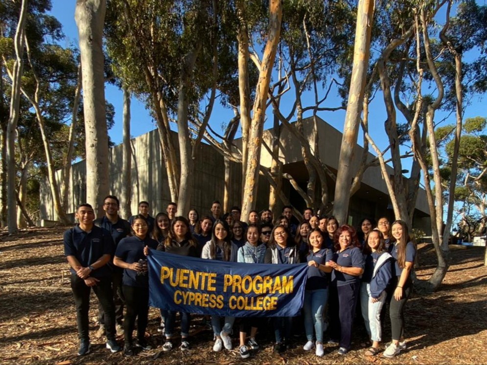 Puente students holding Puente banner