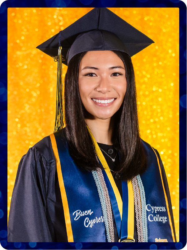 Portrait of Dominique Waddell in commencement regalia