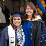 Two smiling women at graduation