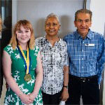 Two faculty members with a student