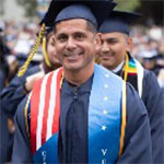 Student at graduation wearing Veterans sash