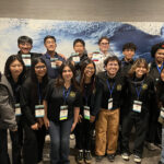 Members of Student Life and Leadership in front of a building