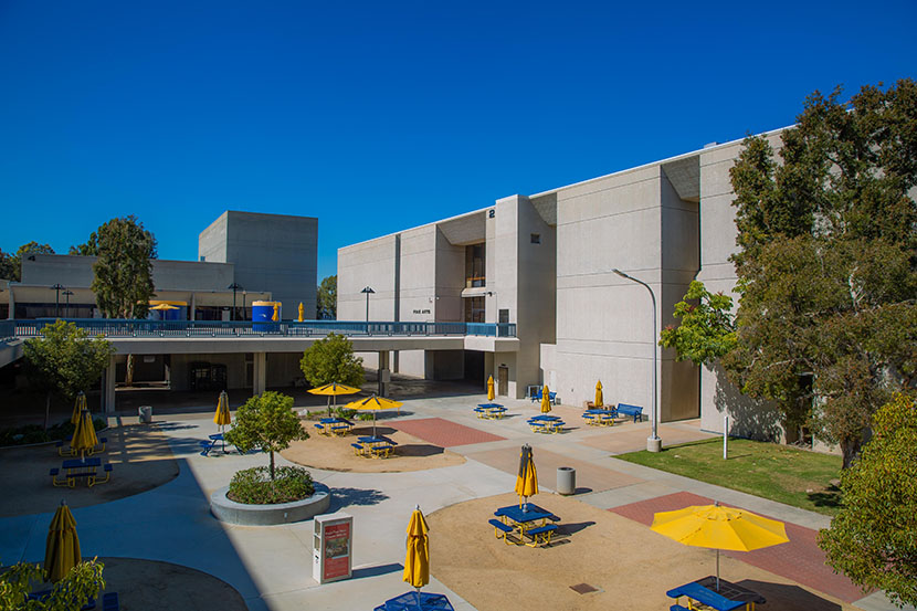 Fine Arts Building with tables and chairs in front