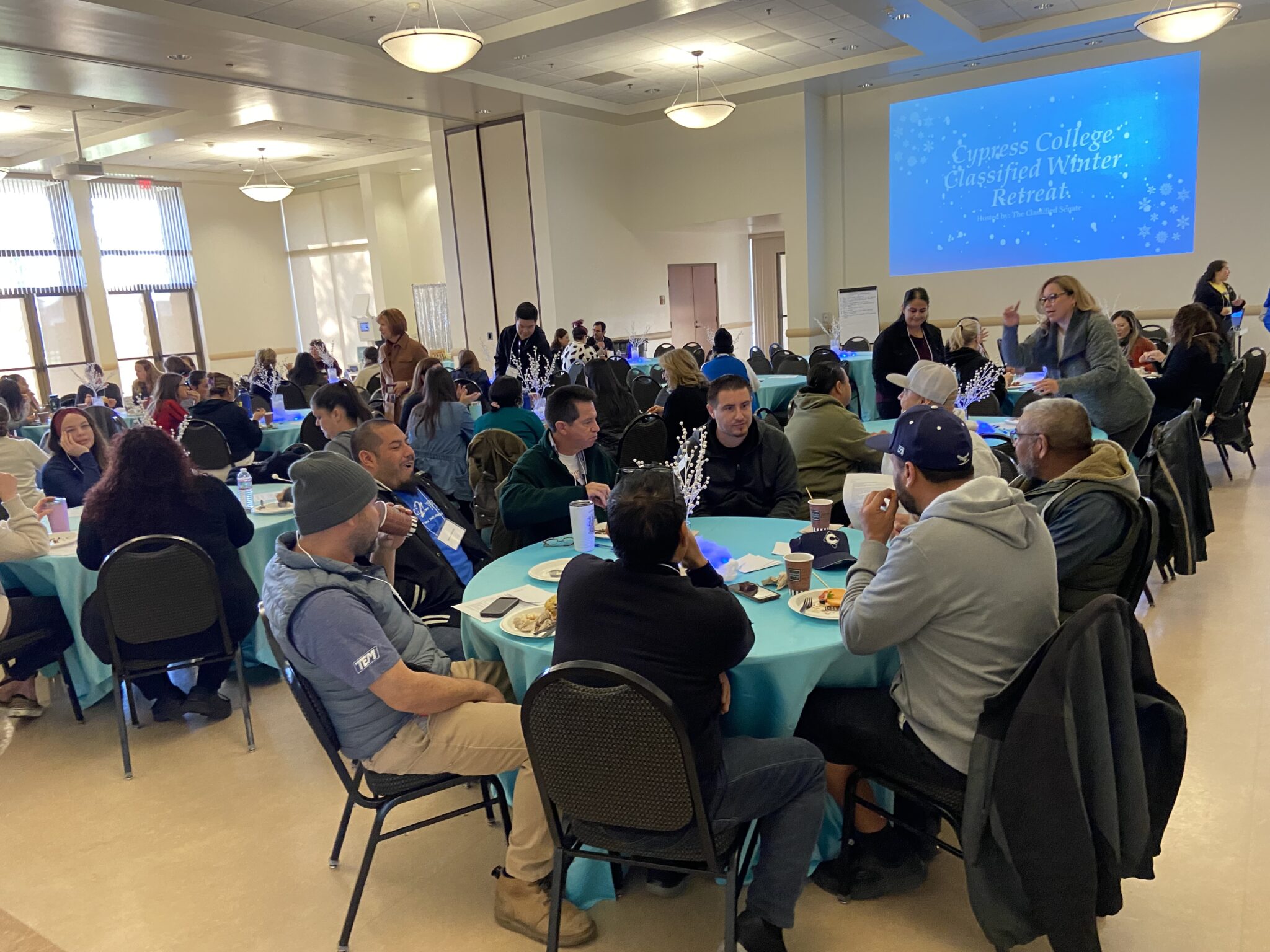 Classified staff eating breakfast and connecting with other colleagues.