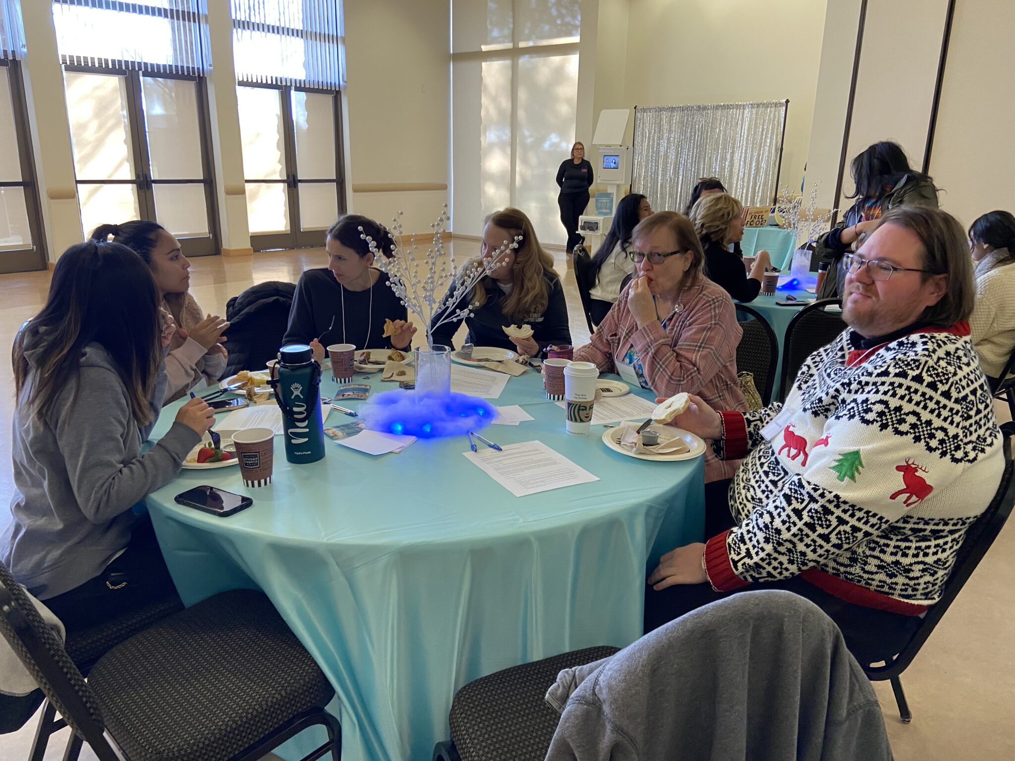 Classified staff having a conversation during breakfast.