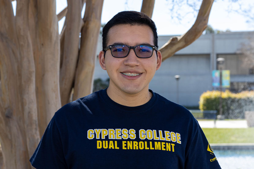 Dual Enrollment staff Rafael Gomez smiling and wearing Cypress College Dual Enrollment sweatshirt