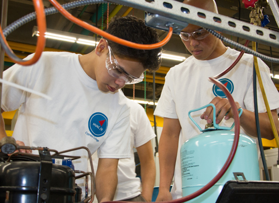 Students working on air conditioning and refrigeration systems