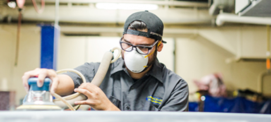 Student working on a car