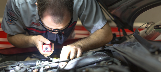 Student working on a car