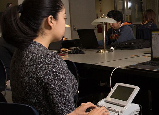 Students working with stenograph machines