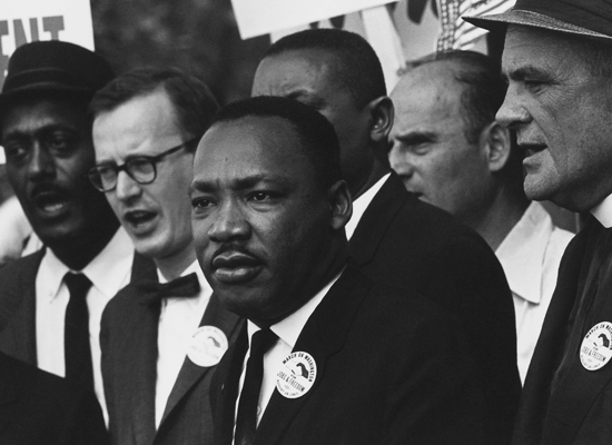 Martin Luther King speaking, along with various other men