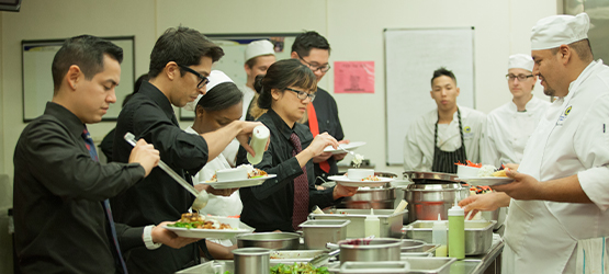 Students preparing meals in a kitchen