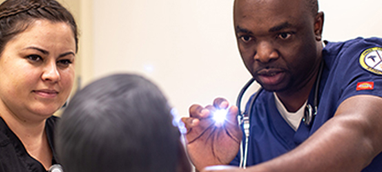 Students checking on a patient