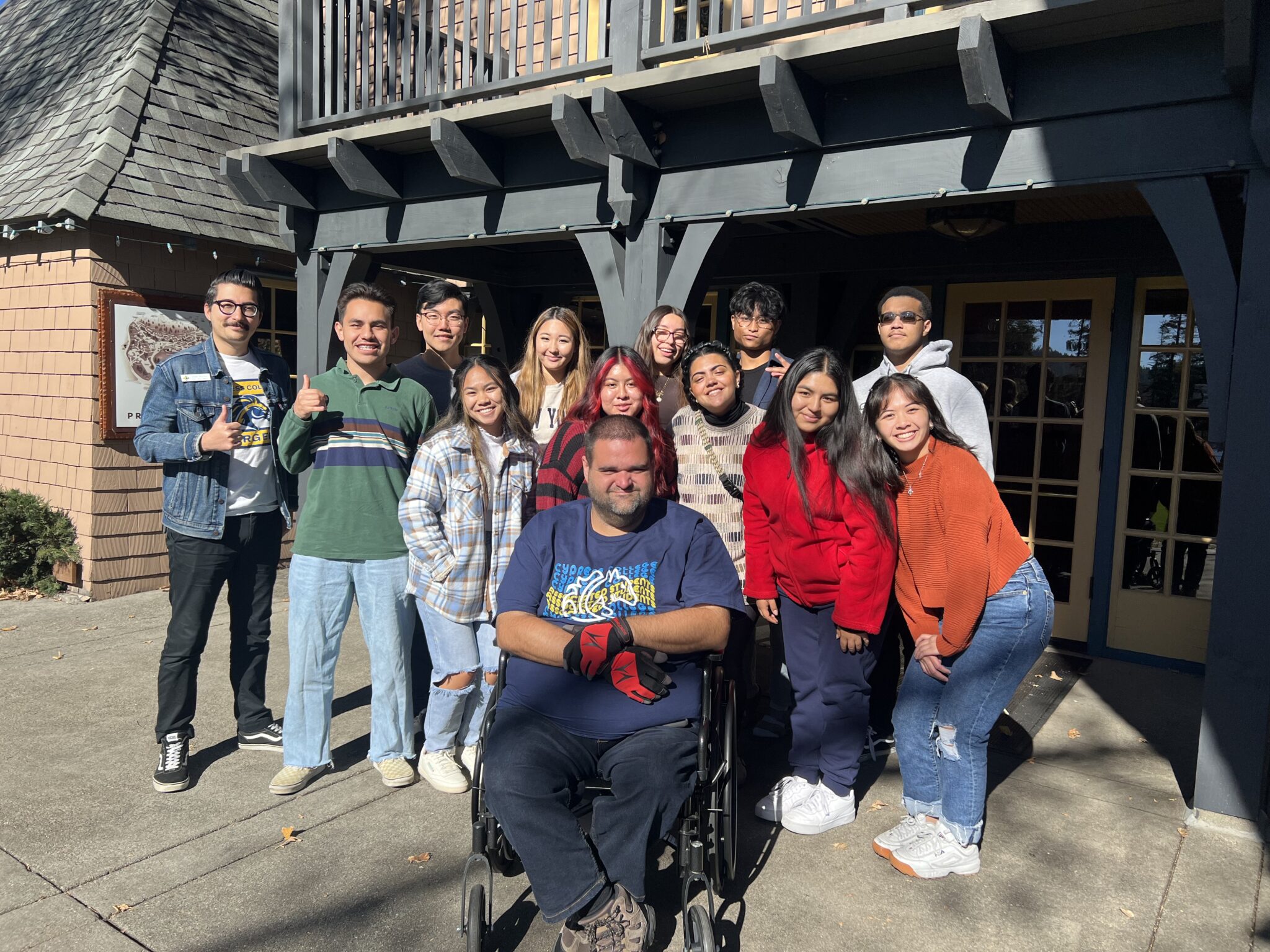 Members of Student Life and Leadership in front of a building