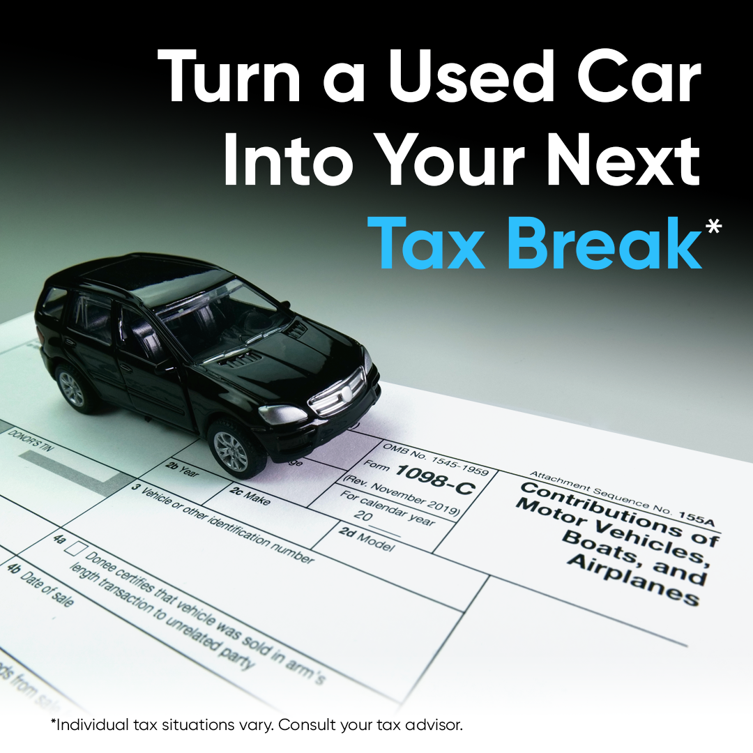 An image of a black SUV on a tax return form with text that says "Turn a Used Car Into your Next Tax Break."
