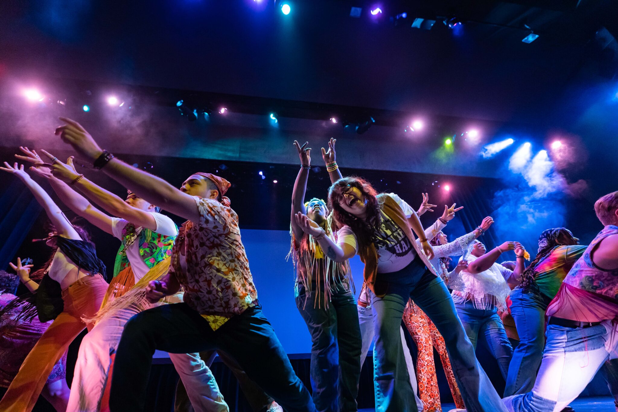 Students performing 'Age of Aquarius' on stage