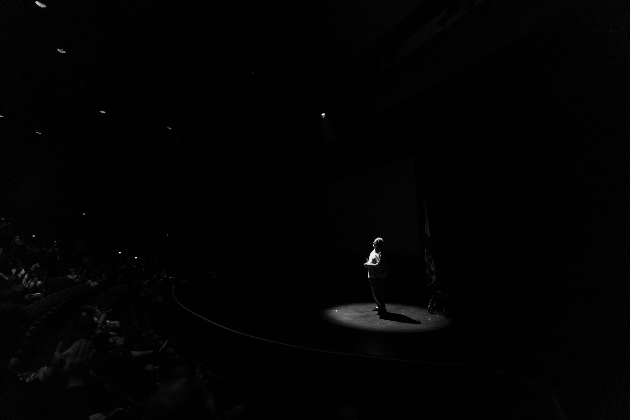 Steve Auger on stage in silhouette