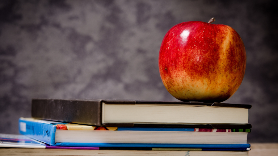 Apple on stack of books