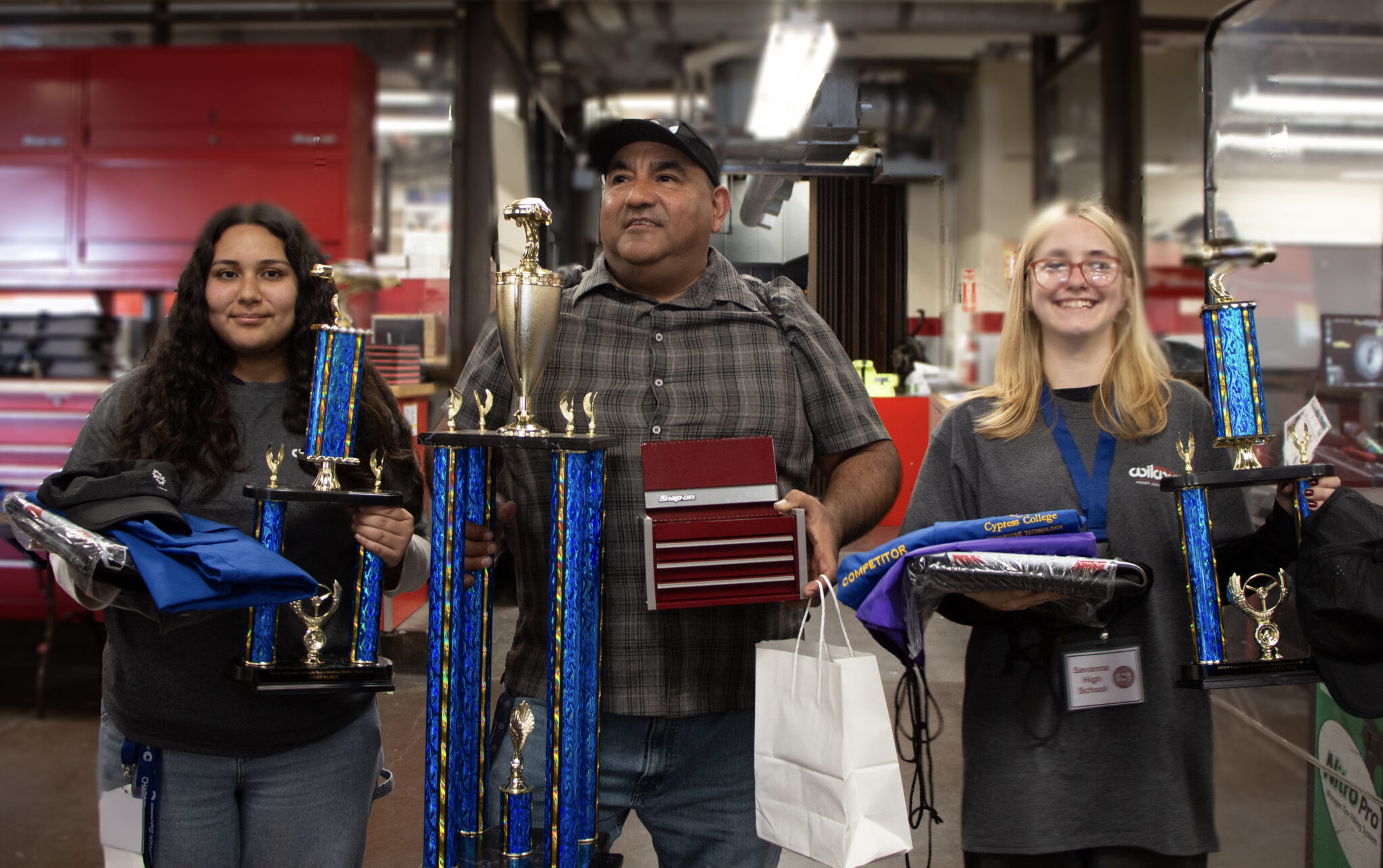 Naomi Prunchak and Natasha Zavala of Savanna High School Regional Occupational Program, with their teacher Carlos Sanchez.