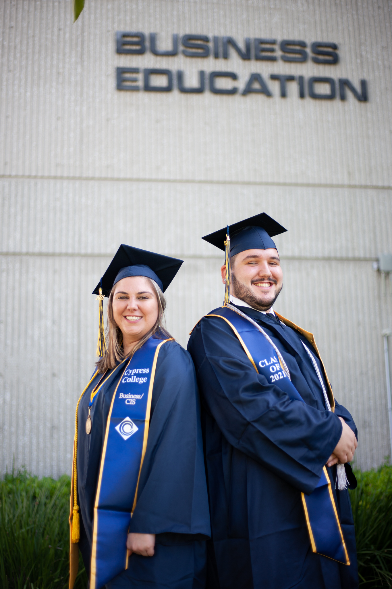 Business student Jacklyn Williamson poses with her brother, who will graduate with her in spring 2021.