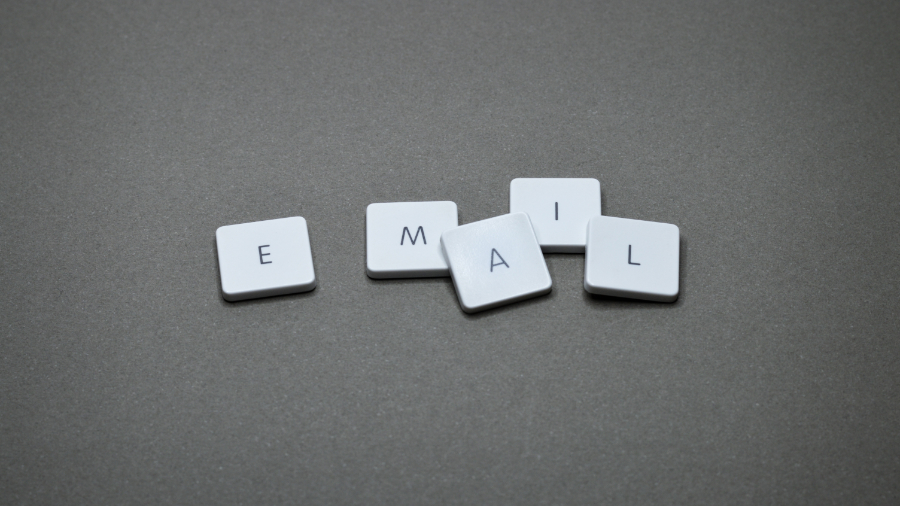 Board game tiles that spell out "E-Mail"