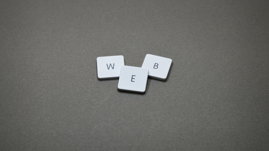 Board game tiles that spell "Web"