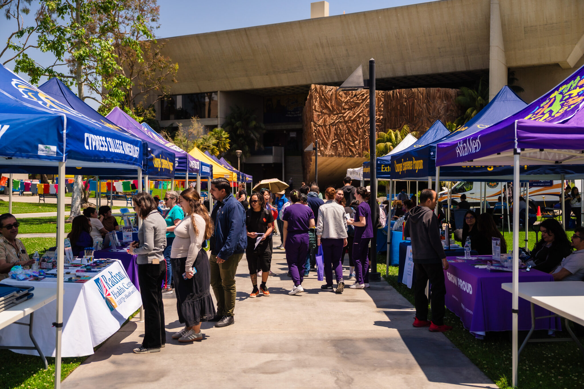 Tents line a walkway in Gateway Plaza during the Student Health and Wellness Fair