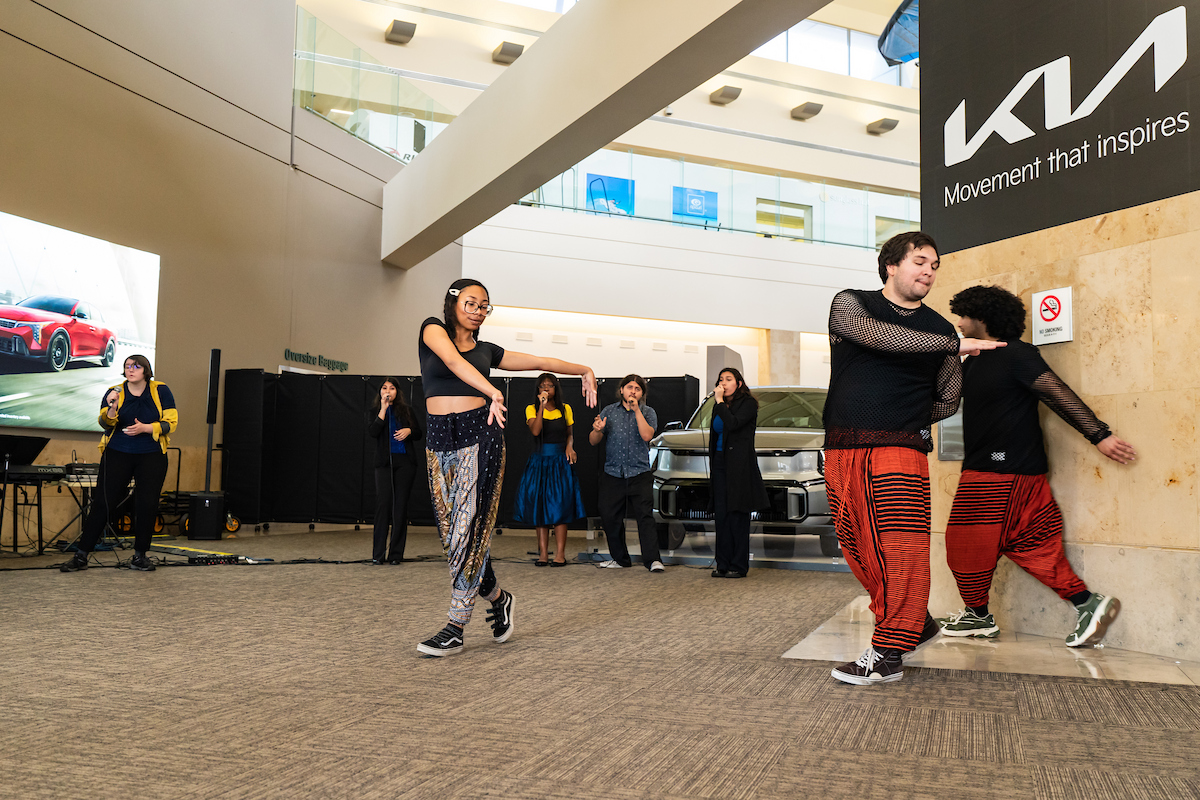 Students dancers and singers perform at John Wayne Airport.