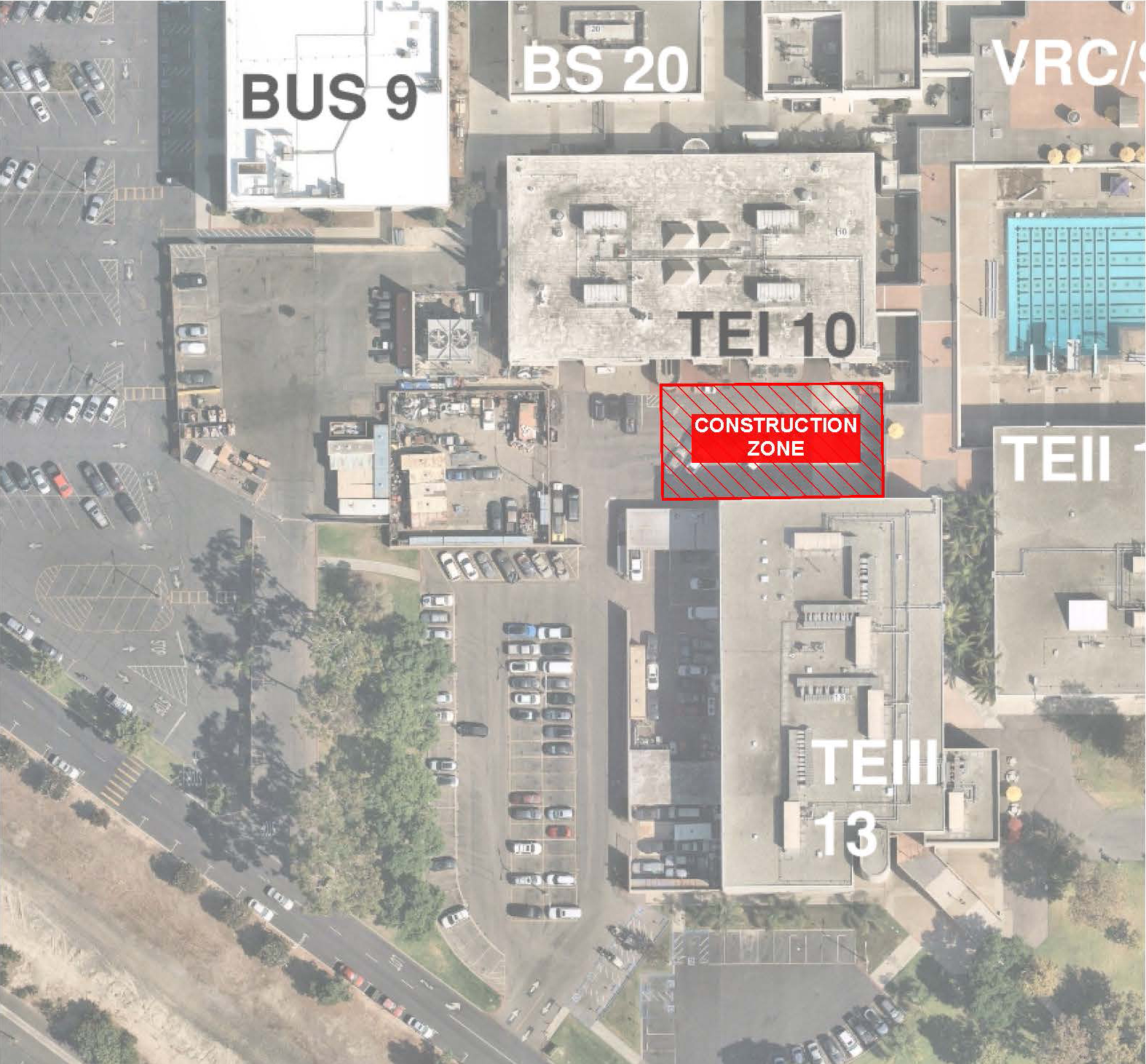 Aerial view of a campus map highlighting a construction zone between buildings TEI 10 and TEIII 13, surrounded by parking areas.