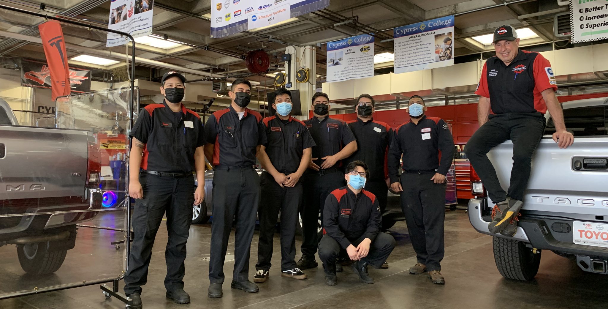 Automotive Technology students on campus in the garage working on the Toyota T-TEN program.