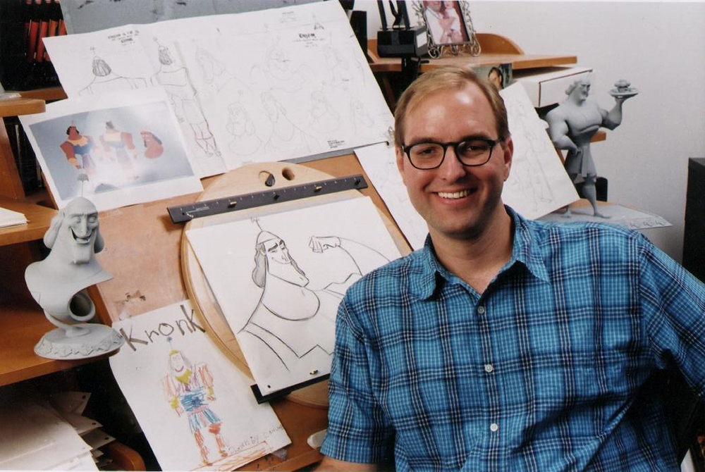 Animator Tony Bancroft poses with some of his drawings.
