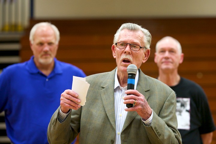 Man speaking into microphone