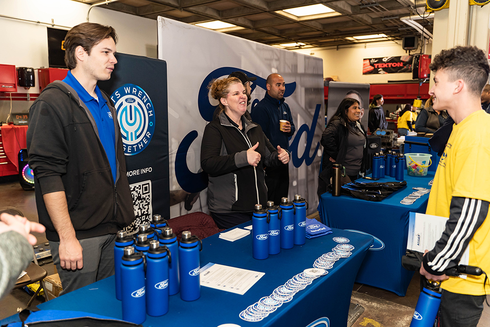 Representatives from Ford Motor Company speak with students who are interested in future careers in the auto industry. 