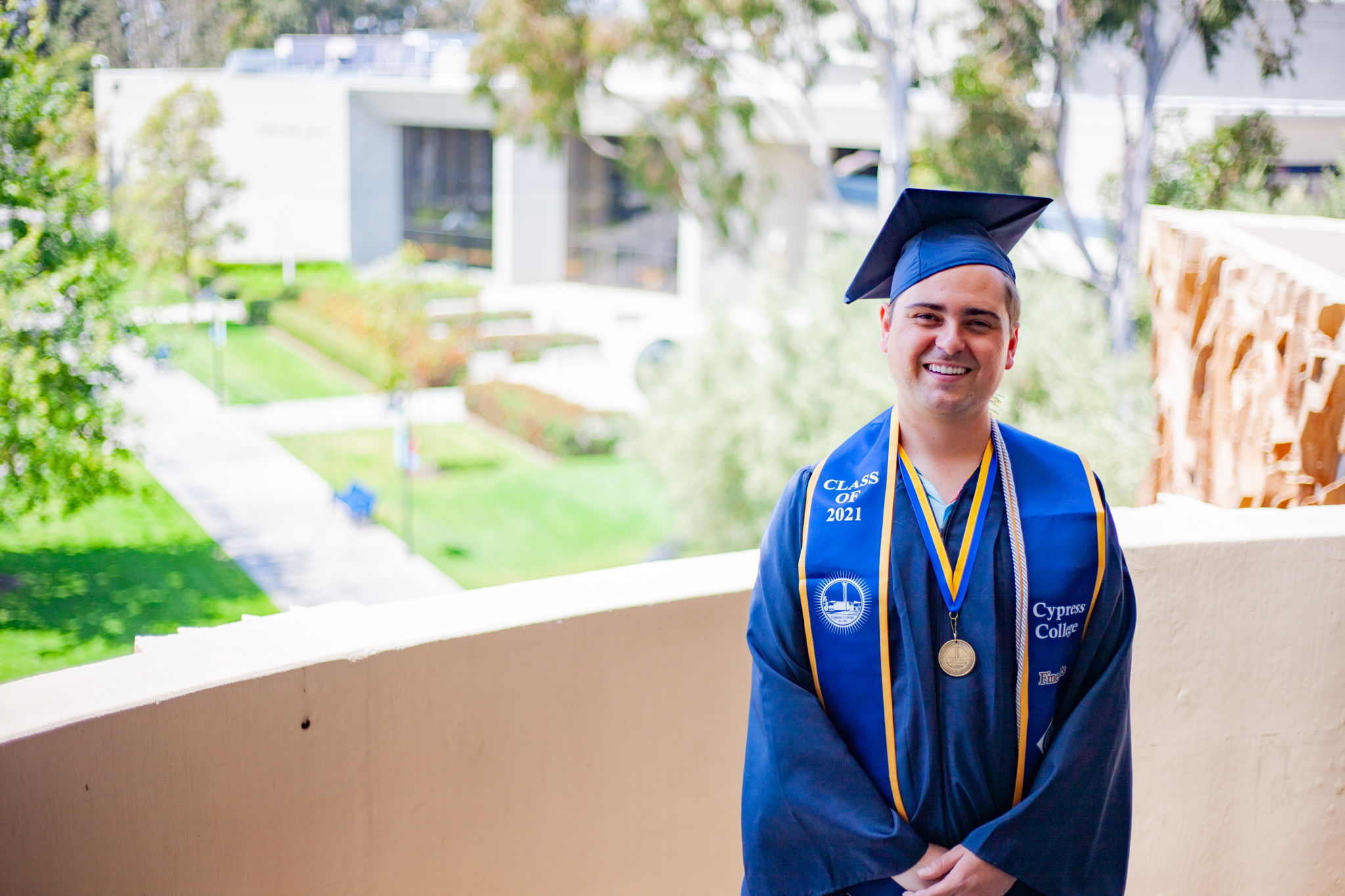 Film student Paul Scott stands on the balcony of the College Complex building. 